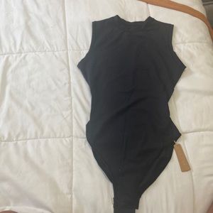 Brand New with Tags. Skims body suit